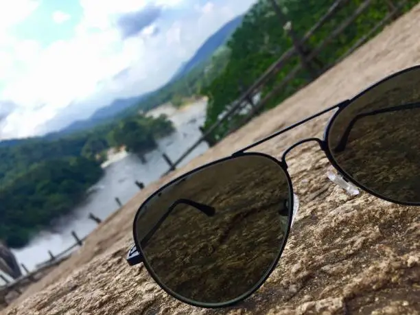 Ray-ban sunglasses with waterfall in a background