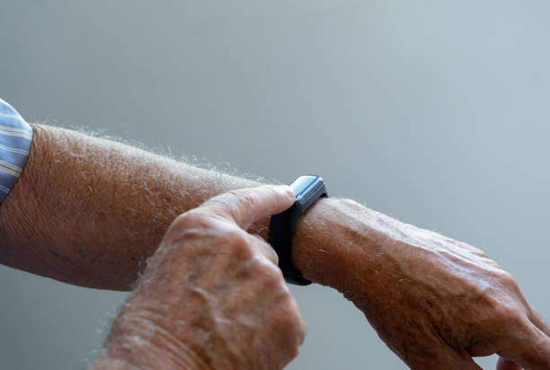 istock Arm of a senior man with a modern watch 1289617769