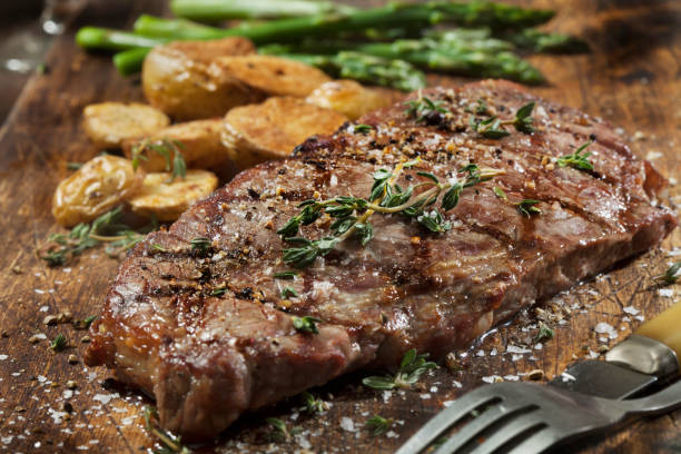 istock Medium Rare Sirloin Steak with Roasted Potatoes and Steamed Asparagus 1289618167