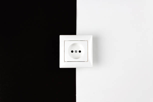 istock Volume of electricity consumption day and night. White socket on paper black and white background. 1289619022