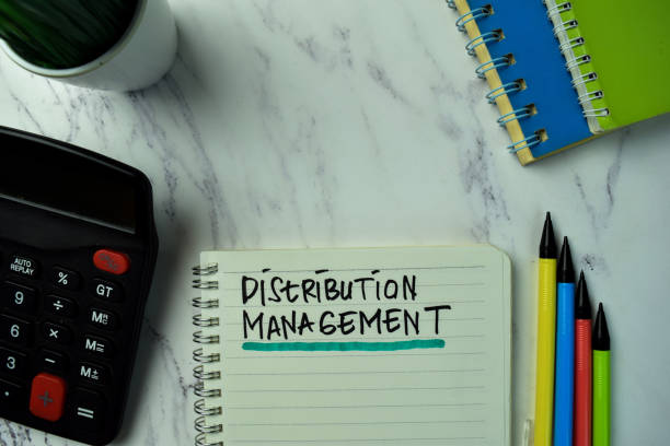 istock Distribution Management write on a book isolated on office desk. 1289619230