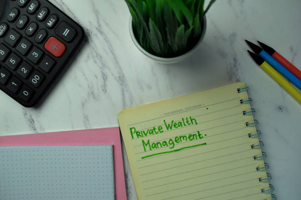 istock Private Wealth Management write on a book isolated on office desk. 1289619231