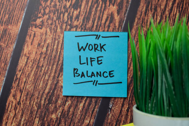 istock Work Life Balance write on sticky notes isolated on office desk. 1289620075