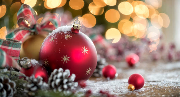 istock Christmas Baubles in front of a Christmas Tree 1289620102