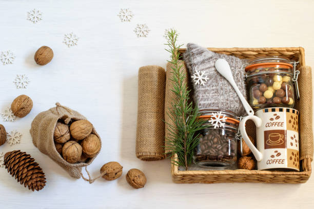 istock Alternative handmade gift box with coffe beans, chocolate beans, coffee cup, warm socks and walnuts. Christmas zero waste homemade gift. 1289623886