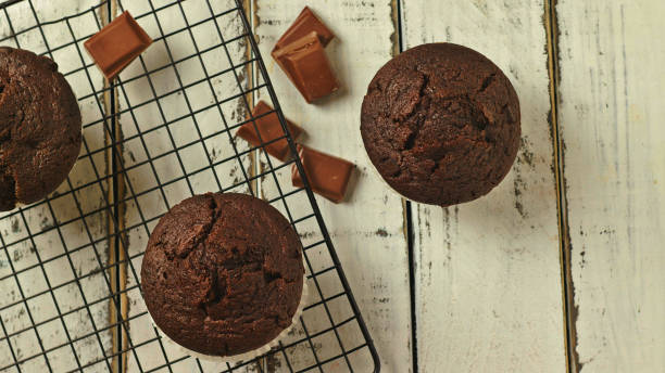 istock chocolate muffins on a white background 1289625641