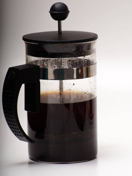 istock A cup of coffee and french press on a white isolated background 1289628558