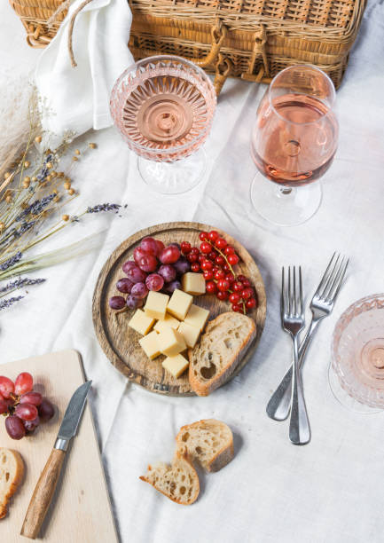 French Summer Picnic with Rose Wine and Cheese French Summer Picnic with Rose Wine and Cheese rose wine photos stock pictures, royalty-free photos & images