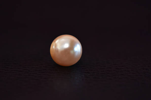 istock Real pearls Selected, beautiful color, laying on the ground, with reflection 1289632685