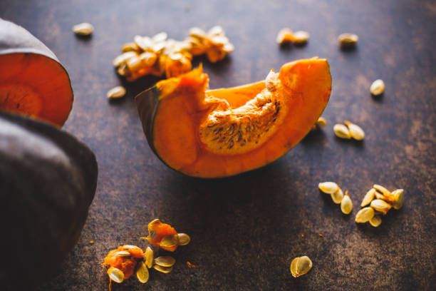 istock Pumpkin seeds surrounding a slice of pumpkin 1289641087