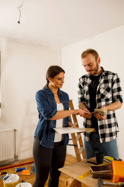 istock Couple choosing which shade they will use for wall paint 1289642552