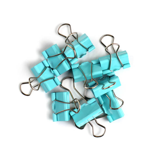 istock Paper clips on a white background close-up. Top view, flat lay, place for text. 1289644243