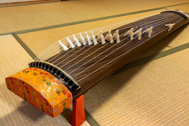 istock Koto, traditional Japanese musical instrument with many strings 1289651203