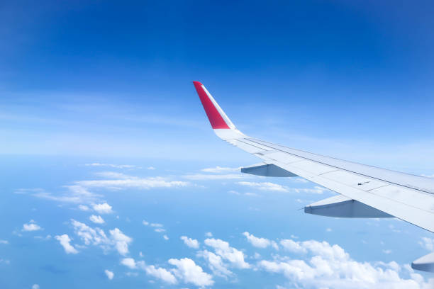 istock sky and wing of the plane 1289653850