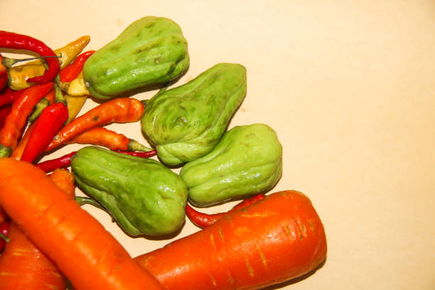 istock Carrot , Chilli , Siamese Pumpkin shoot in yellow background 1289657911