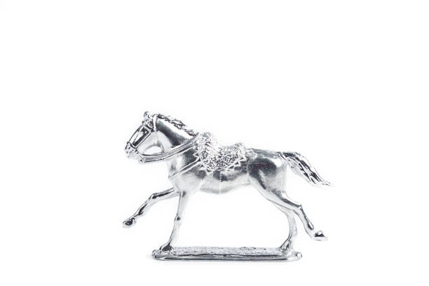 istock Image of handmade unpainted tin horse on the white background 1289662396