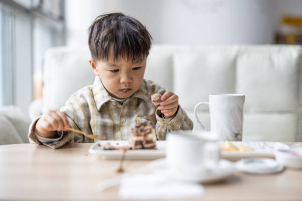 istock Asian Boys having breakfast in a coffee shop 1289664189