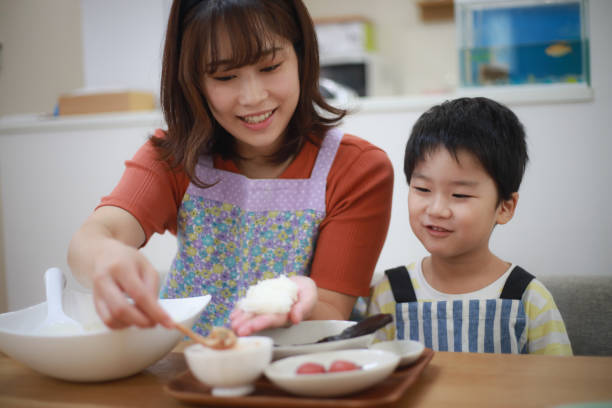 istock Parents and children holding rice balls 1289668657
