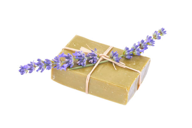 istock Handmade olive soap and lavender flower isolated on white background. 1289669238