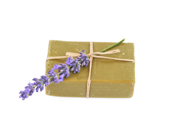 istock Handmade olive soap and lavender flower isolated on white background. 1289669249