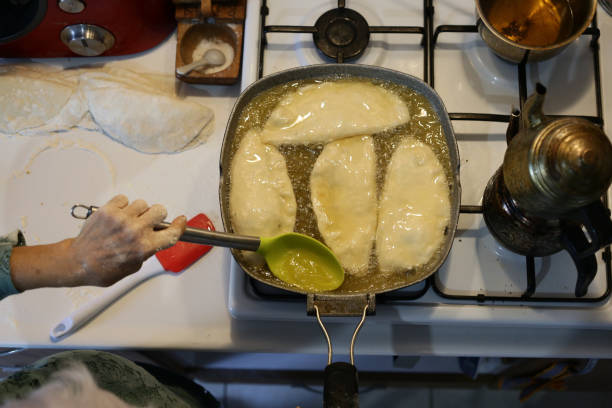 A type of fried dough made with flour, yeast, milk, eggs, margarine, salt, sugar and oil found in Central Asian and Middle Eastern cuisines