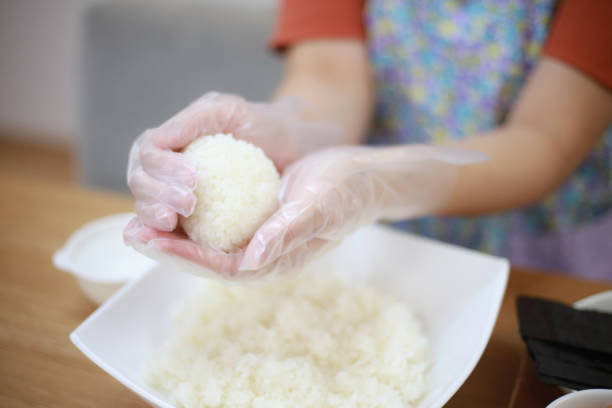 A woman holding a rice ball