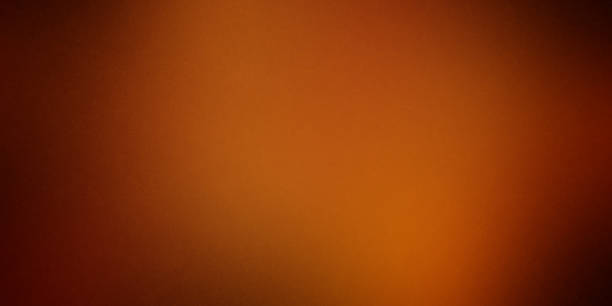 istock Abstract Dark Orange Grunge Background 1289671063
