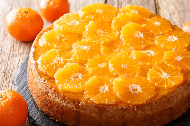istock Fresh fruit tangerine pie close-up on a slate board. horizontal 1289672933