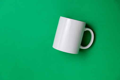 A yellow cup on a white background.