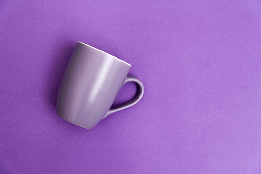Purple mug on purple background