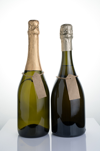 Three clipping paths: bottle + label inside + label outside. Isolated on black.