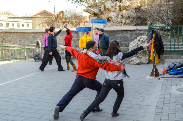Beijing / China - January 25, 2014: People dancing in Beihai park in Beijing, China