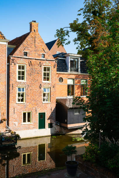 istock Houses along canal in Appingedam, The Netherlands 1289680901