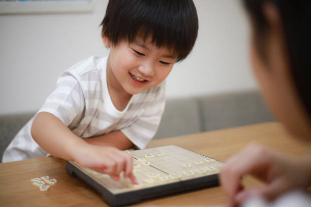 istock Parent and child pointing to shogi 1289680976