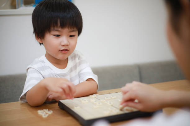 istock Parent and child pointing to shogi 1289681101