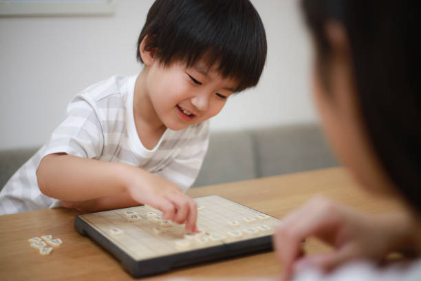 istock Parent and child pointing to shogi 1289681185