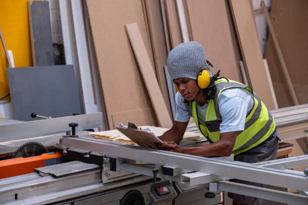 istock Timber worker plans and measure his cuts of wood 1289683105