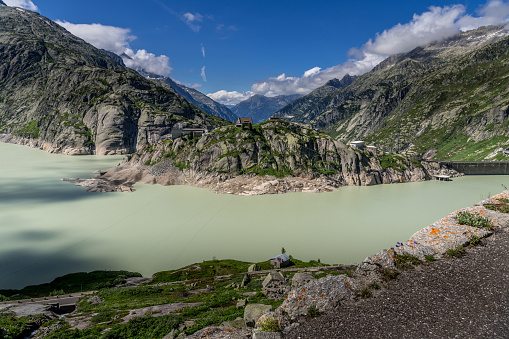 Aerial view of Grimselsee (Lake Grimsel) and Grimsel Hospice in sunny day during summer, Switzerland