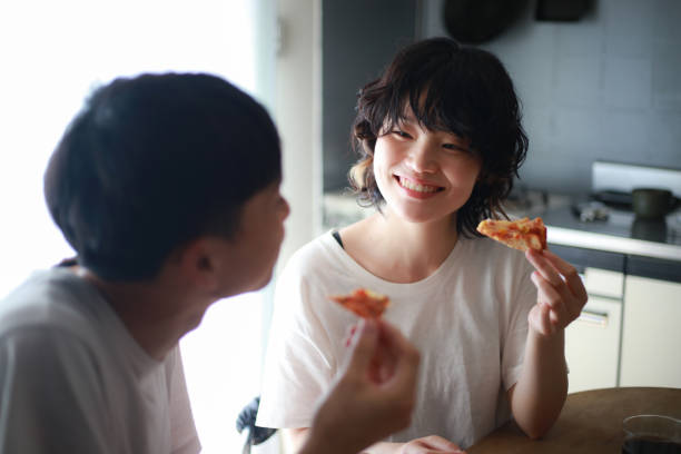 Couple eating pizza
