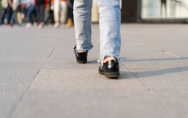 istock Little Girl Walking on Street 1289687295