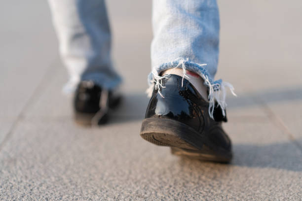 istock Little Girl Walking on Street 1289687973