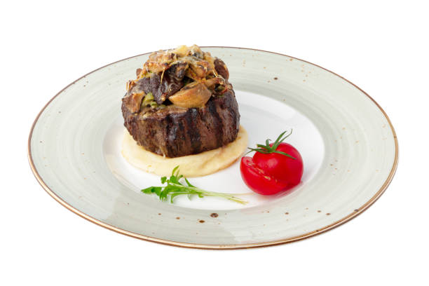 istock Grilled medallion of veal isolated on white 1289690246