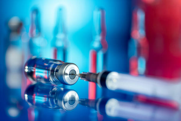 Vaccines and syringe in a laboratory stock photo
