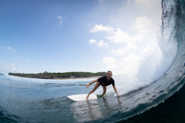 istock Up close to surfing girl 1289691677