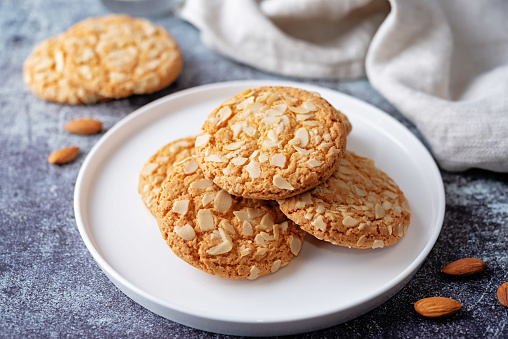 Cookies with almond with glass of milk. toning. selective focus