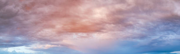 istock Fluffy clouds in evening overcast sky panoramic view. Climate, environment and weather concept sky background. 1289692790