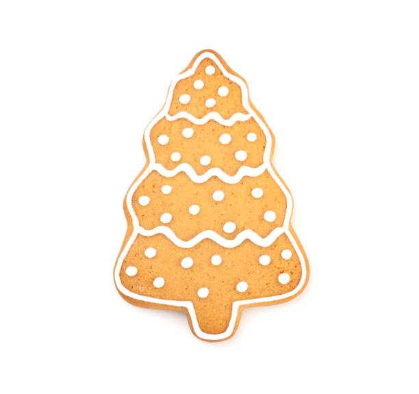 istock Christmas ginger and honey cookies form a Christmas tree covered with icing isolated on a white background 1289694627