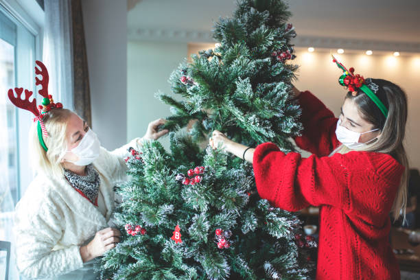 istock Celebrating Christmas, decorating the christmas tree 1289694699