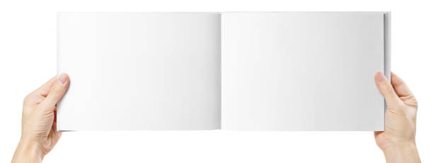 istock Hands holding open wide album on white 1289697324