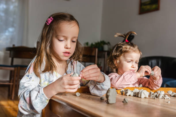istock Children playing with dough at home 1289698188